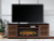 Ashley Kallari Warm Brown Black 84" TV Stand with Electric Fireplace