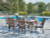 Ashley Rainier Ranch Brown Beige Outdoor Dining Table and 6 Chairs P701/625/601A(2)/602A