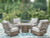 Ashley Rainier Ranch Beige Outdoor Fire Pit Table and 4 Chairs