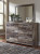 Benchcraft Derekson Multi Gray Queen Panel Bed with 6 Storage Drawers with Mirrored Dresser and 2 Nightstands