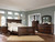 Ashley Porter Rustic Brown King Panel Bed with Mirrored Dresser, Chest and 2 Nightstands