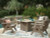 Ashley Carisbo Beige Outdoor Fire Pit Table and 4 Chairs