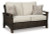 Ashley Paradise Trail Medium Brown Outdoor Loveseat and 2 Lounge Chairs with Fire Pit Table