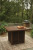 Ashley Paradise Trail Medium Brown Bar Table with Fire Pit