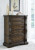 Ashley Maylee Dark Brown Queen Upholstered Bed with Mirrored Dresser, Chest and 2 Nightstands