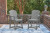 Ashley Ross Cove Dark Gray Outdoor Counter Height Dining Table and 4 Barstools