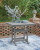 Ross Cove Dark Gray Outdoor Counter Height Dining Table and 4 Barstools