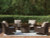 Ashley Drakes Beach Dark Brown Outdoor Fire Pit Table and 4 Chairs