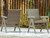 Ashley Carisbo Beige Outdoor Rocking Arm Chair (Set of 2)