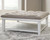 Ashley Kanwyn Grayish Brown White Upholstered Ottoman Coffee Table