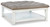 Ashley Kanwyn Grayish Brown White Upholstered Ottoman Coffee Table