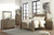 Ashley Trinell Brown Queen Poster Bed