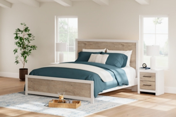 Ashley Charbitt Two-tone King Panel Bed