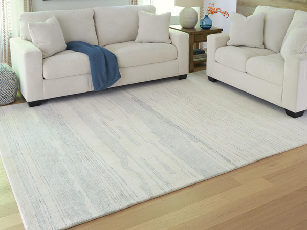 Ashley Genemost Ivory Blue 7'8" x 10' Area Rug