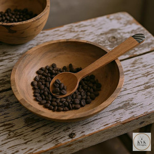 Olive Wood Coffee Scoop with Batik Handle sitting in coffee beans in olive wood bowl