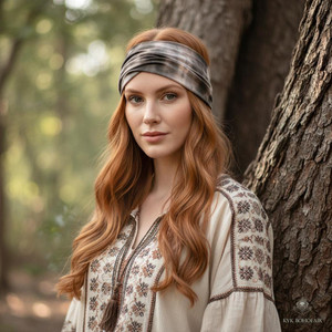 Brown Tie-Dye Boho Headband worn by model standing by a tree