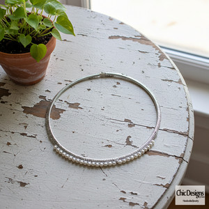 Freshwater Pearl and Green Silk Woven Choker sitting on a white distressed table Freshwater Pearl and Green Silk Woven Choker sitting on a white distressed table