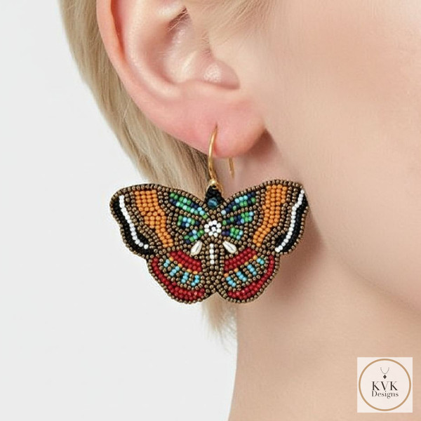 Beaded Butterfly Earring closeup worn on model