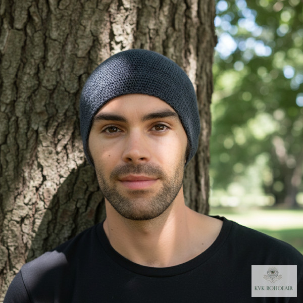 Modeling wearing Gray Kufi Skull Cap standing against a tree Modeling wearing Gray Kufi Skull Cap standing against a tree