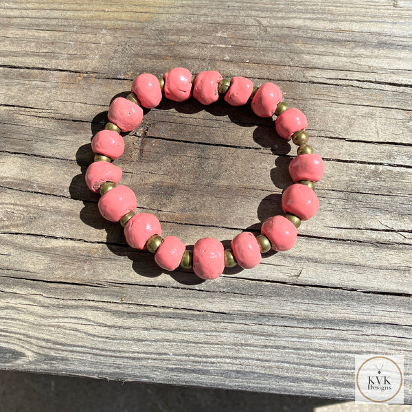 Coral Pink Clay Bead Bracelet - On Wood