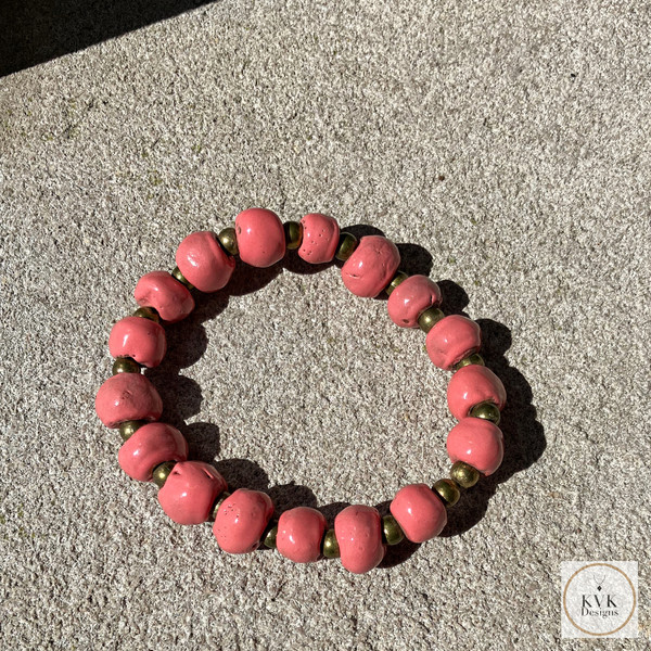 Coral Pink Clay Bead Bracelet - On Cement