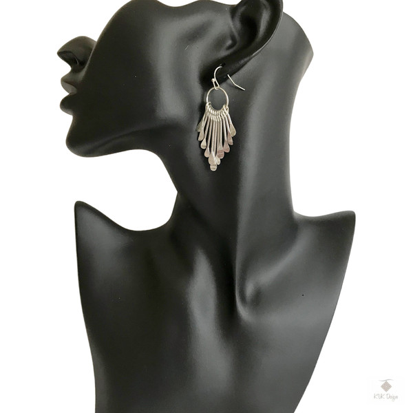 Boho Silver Metal Fringe Paddle Earrings displayed on mannequin model