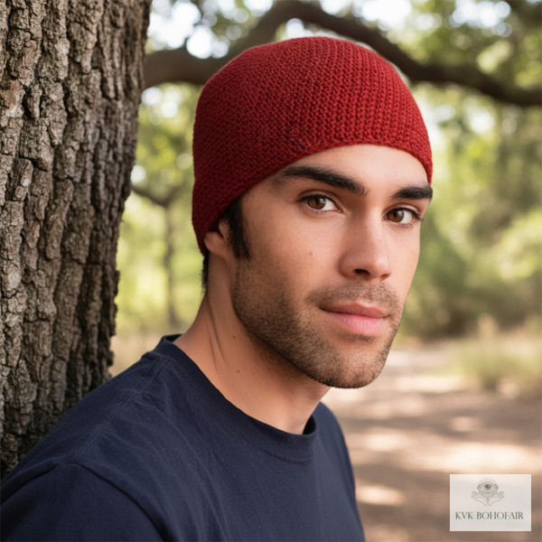 Model wearing Red Kufi Skull Cap Beanie standing by a tree Model wearing Red Kufi Skull Cap Beanie standing by a tree