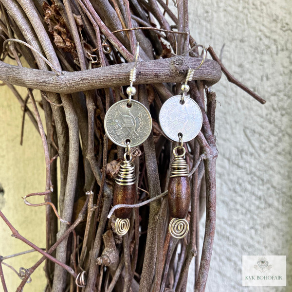 Handcrafted Guatemalan Coin Earrings hanging from a wood wreath