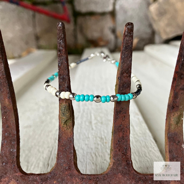 Handcrafted Boho Anklet with Turquoise & Silver Beads on an antique rake