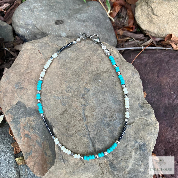 Handcrafted Boho Anklet with Turquoise & Silver Beads on a rock