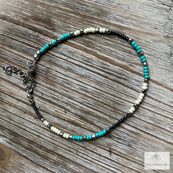 Handcrafted Boho Anklet with Turquoise & Silver Beads on a wood table