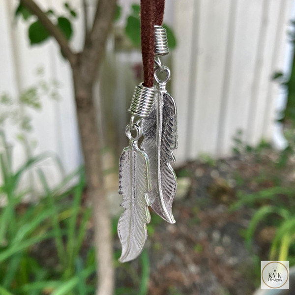 Boho Chic: Brown Suede Lariat Feather Necklace showing the silver feathers
