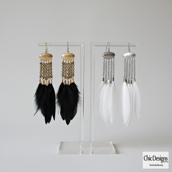 Brass and Feather Chandelier Earrings studio shot of black and white feather chandelier 
earrings