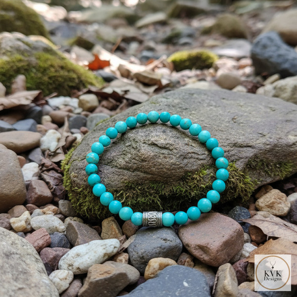 Blue Magnesite Bead Bracelet sitting on rocks outside