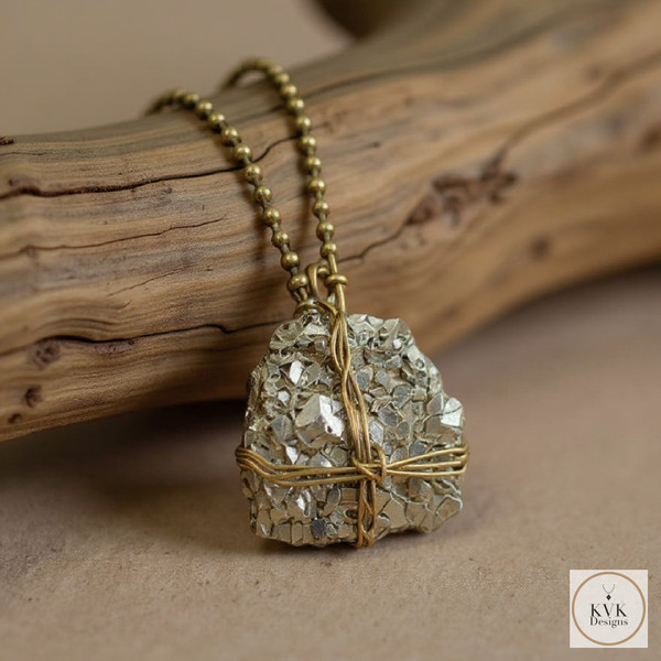 Pyrite Wire-Wrapped Necklace draped over a log