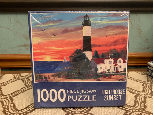 New sealed 1000-piece lighthouse sunset jigsaw puzzle, unopened in shrink-wrap.