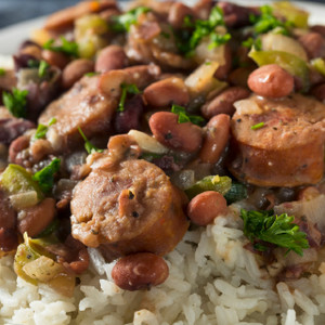 Smoked Pork Andouille Brats Sliced over Red Beans and Rice Smoked Pork Andouille Brats Sliced over Red Beans and Rice