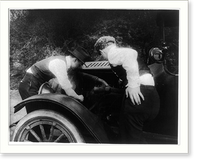 Men looking under hood of auto, Vintage Poster