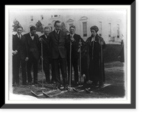 President & Mrs. Coolidge on skis on the White House lawn during visit of members of the National Ski Assn., Dec. 18, 1924, Antique Print