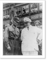 Hermann Goering, three-quarter length, standing, wearing Luftwaffe uniform, talking with unidentified man in SA uniform on the street in Dinkelsb&uuml;hl, Germany, Vintage Print