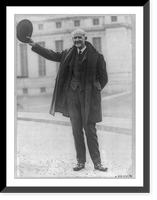 Eugene Victor Debs, 1855-1926, full-length portrait, standing, holding hat in air, facing left, outside of Federal Penitentiary, Atlanta, Ga, Historic Print