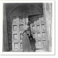 Mexican-Americans in Southwestern U.S., 1901?: woman opening carved wooden church door, Historic Print