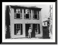 Mark Twain standing in doorway of his boyhood home on Hill Street, Hannibal, Missouri, Historic Reproduction