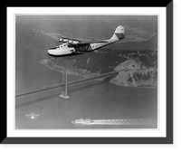 Aerial view of Pan American Airways Philippine Martin Clipper ship in flight over San Francisco-Oakland Bay Bridge, Historic Print