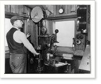 Bridge tender Edward Lundahl posed with the gongs, phone, and other signal alarms and controls in the guard building on the Link Bridge, Chicago, Historic Reproduction