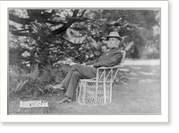 Woodrow Wilson, full, seated in wicker chair on lawn of Prospect, his home at Princeton, N.J., facing left, Vintage Print
