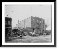 Horse-drawn wagons in front of Ladau Cab building beside railroad yards, St. Louis, Missouri, Antique Poster
