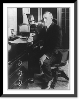 Historic Framed Print, [Woodrow Wilson, 1856-1924, full, seated, facing left, writing at his desk],  17-7/8" x 21-7/8"