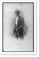 Historic Framed Print, [Christian A. Fleetwood, three-quarters portrait, standing, in straw hat, facing slightly left],  17-7/8" x 21-7/8"