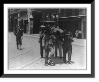 U.S. Navy in action at Vera Cruz, Mexico, 1914: rifleman walking behind 4 Mexicans carrying wounded man on stretcher, Vintage Print
